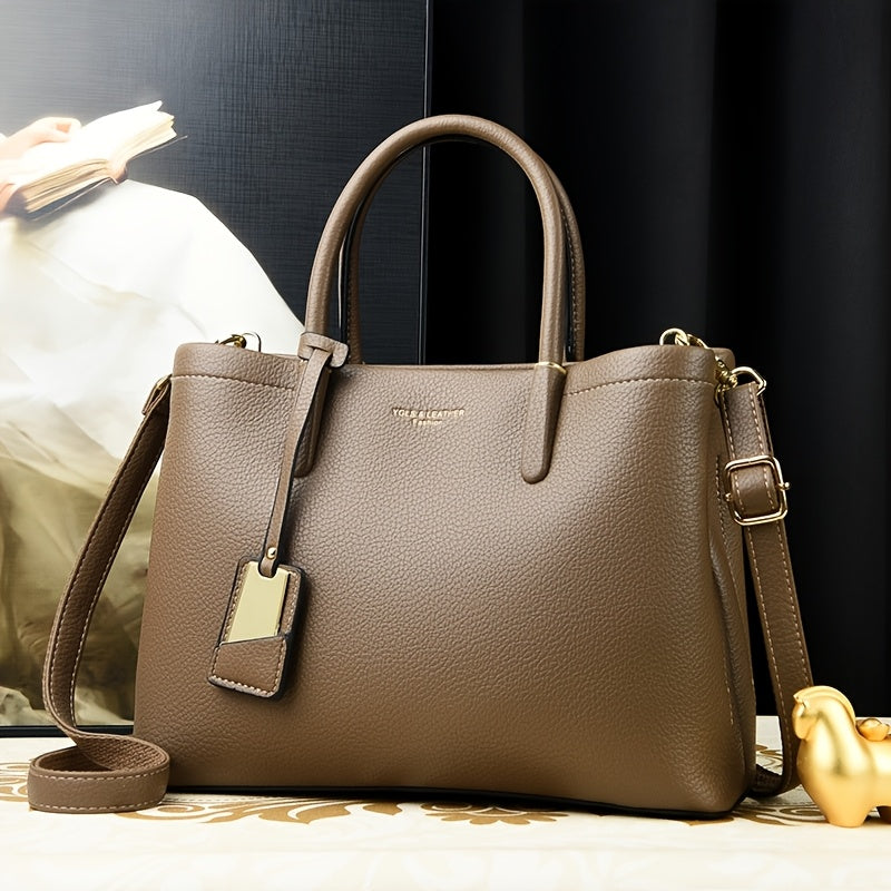 Elegant black handbag with adjustable strap and zipper closure