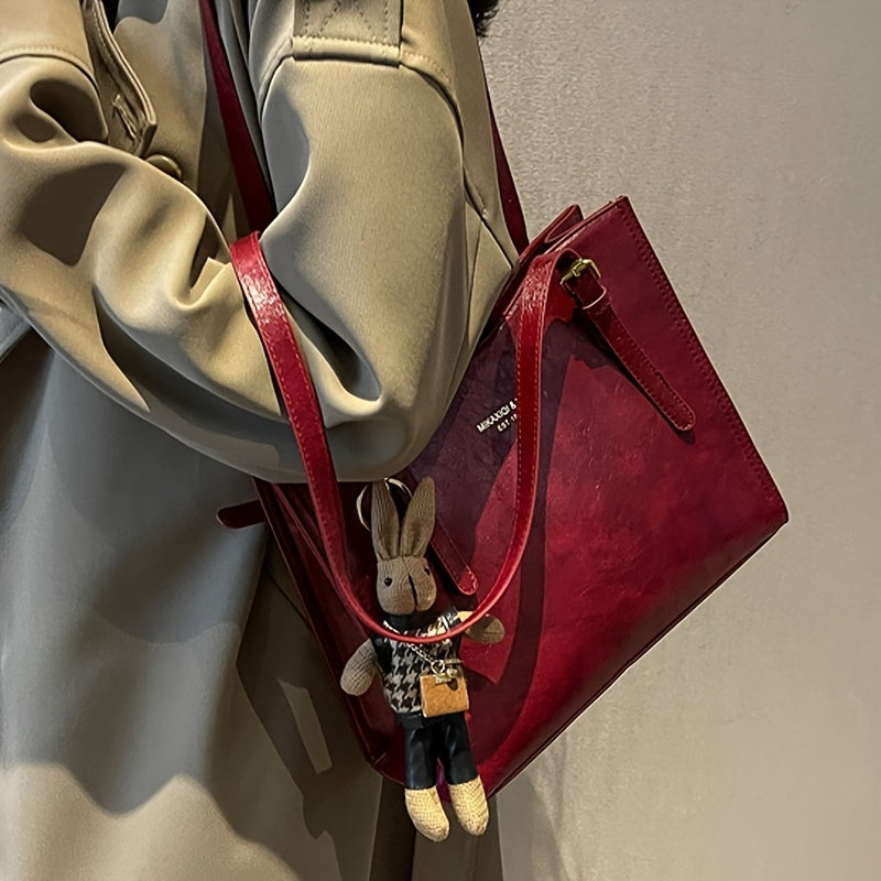 Elegant red tote bag with bunny charm for special occasions
