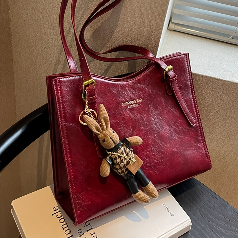 Elegant red tote bag with bunny charm for special occasions