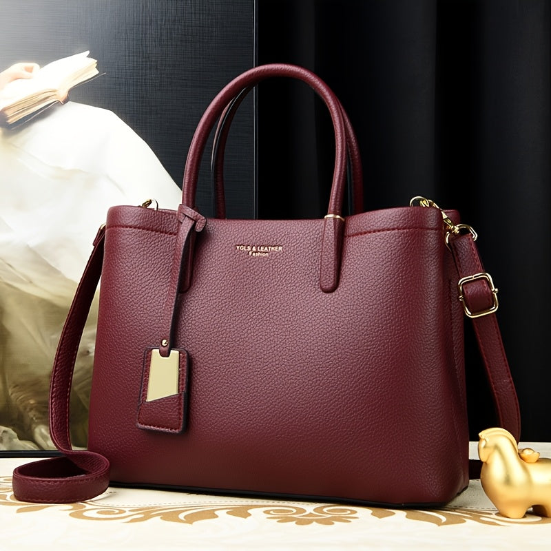 Elegant black handbag with adjustable strap and zipper closure