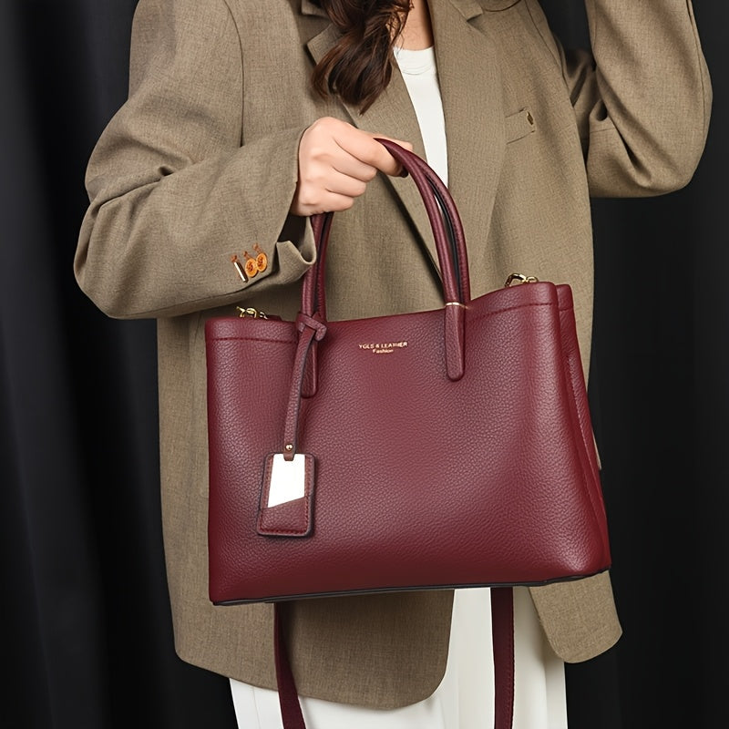 Elegant black handbag with adjustable strap and zipper closure