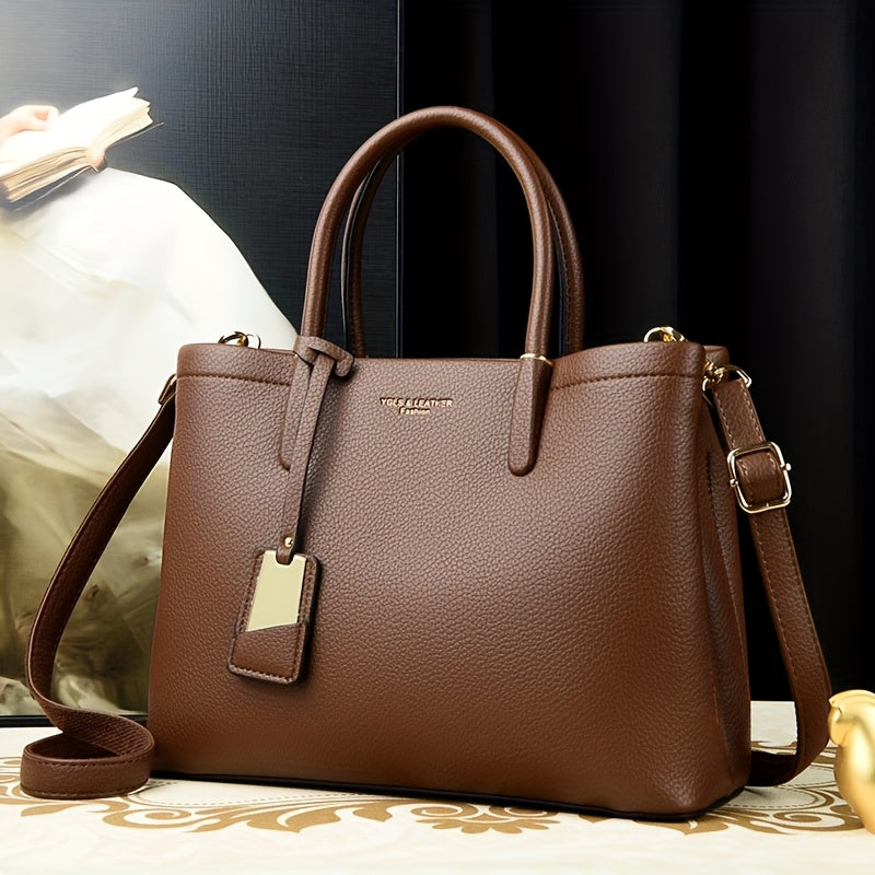 Elegant black handbag with adjustable strap and zipper closure