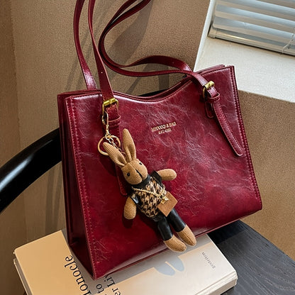 Elegant red tote bag with bunny charm for special occasions